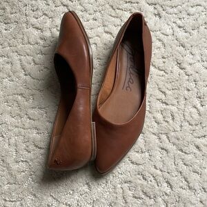 Brown leather flats
